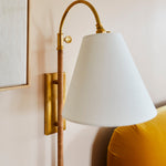 Movement Plug - In Wall Sconce in Aged Brass