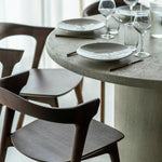 Elements dining table - varnished Microcement - Off White - round White Cliff Studio Dining Table