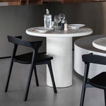 Elements dining table - varnished Microcement - Off White - round White Cliff Studio Dining Table