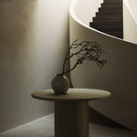 Elements dining table - varnished Microcement - Off White - round White Cliff Studio Dining Table