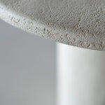 Elements dining table - varnished Microcement - Off White - round White Cliff Studio Dining Table