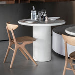 Elements dining table - varnished Microcement - Off White - round White Cliff Studio Dining Table