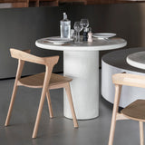 Elements dining table - varnished Microcement - Off White - round White Cliff Studio Dining Table