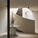 Elements dining table - varnished Microcement - Off White - round White Cliff Studio Dining Table