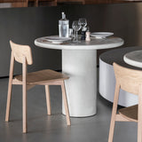 Elements dining table - varnished Microcement - Off White - round White Cliff Studio Dining Table