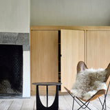 Geometric side table - varnished oak - black - round White Cliff Studio Side Table