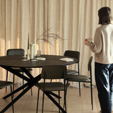 Mikado dining table - varnished oak - black - round White Cliff Studio Dining Table