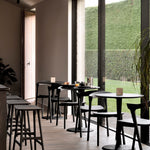 Torsion dining table - varnished oak - black - round White Cliff Studio Dining Table