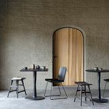 Torsion dining table - varnished oak - black - round White Cliff Studio Dining Table