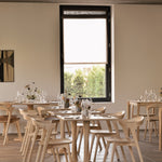 Torsion dining table - varnished oak - round White Cliff Studio Dining Table